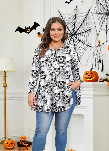 Woman wearing a skull-patterned top in a Halloween-themed room with pumpkins and spider webs.