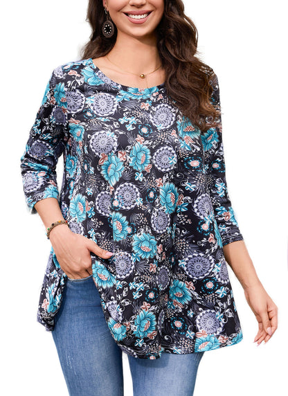 Woman wearing a floral patterned long-sleeve top with blue jeans on a white background