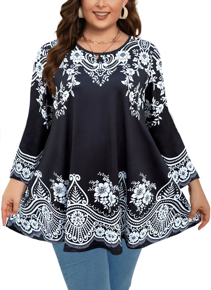 Woman wearing a black top with white floral embroidery on a white background